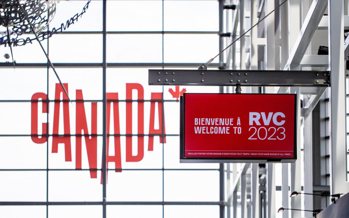 Canada branded window decal and a TV screen that's branded to welcome people to the trade show