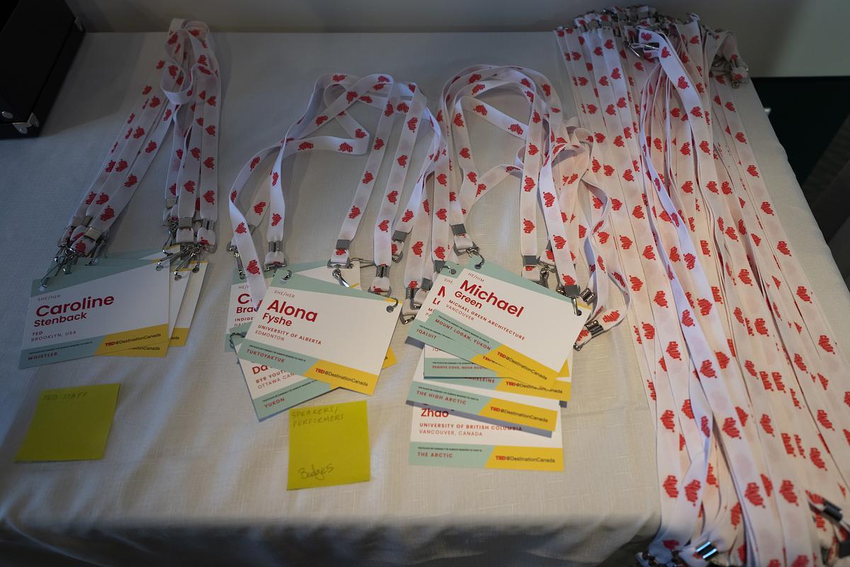 DestinationCanada branded lanyards with name badges piled up on a table